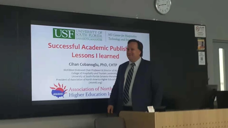 Dr. Cobanoglu giving a talk on academic publishing